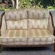 Two-seater Louis XVI canapé in golden beige fabric and curved solid wood.