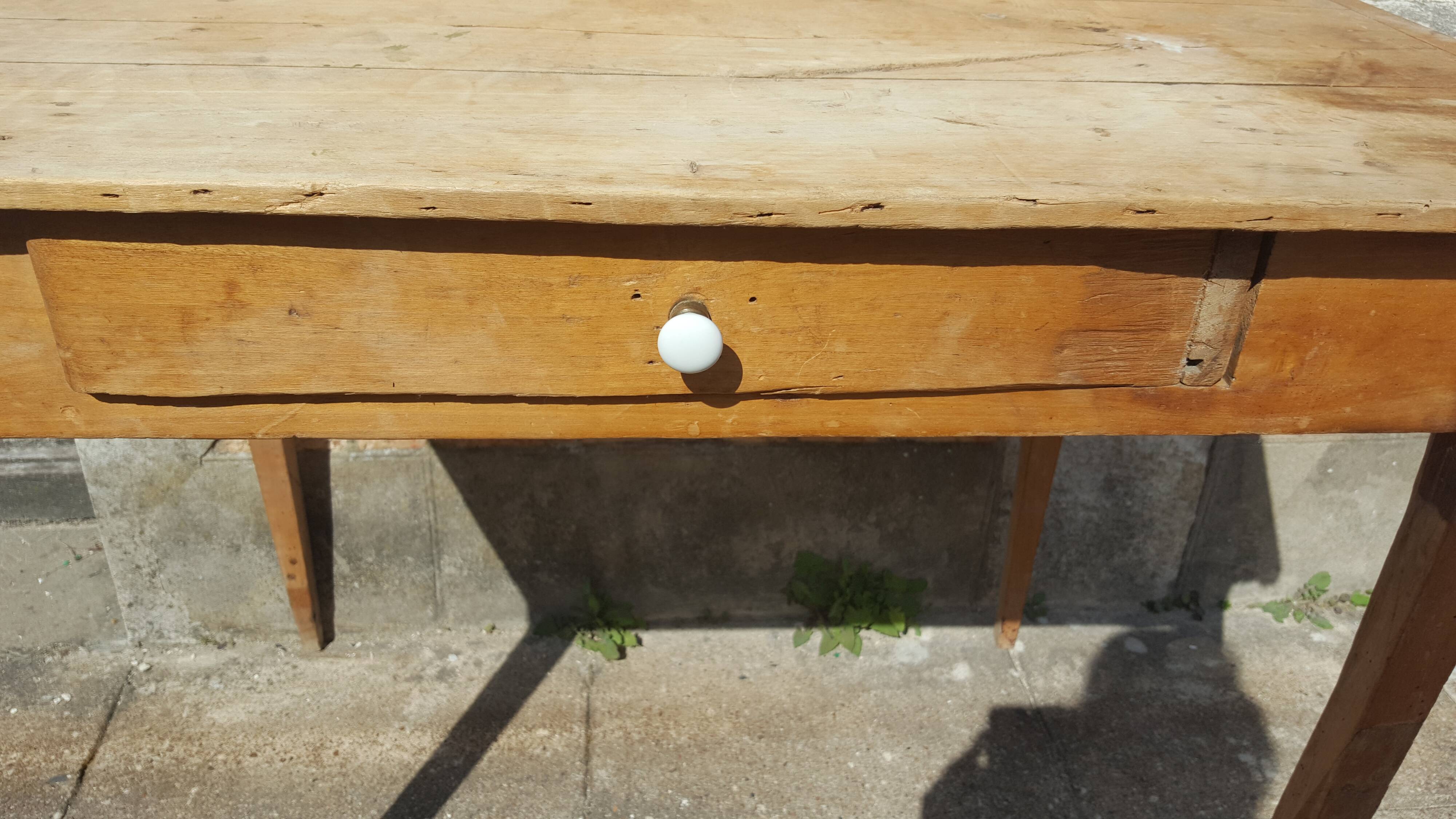 Raw wood farm table with drawer