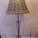 Tripod floor lamp with metal base and skin shade