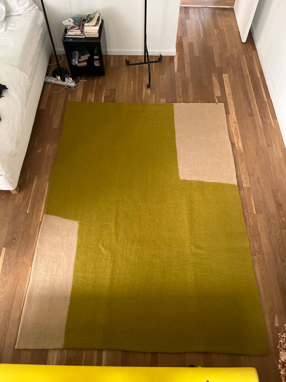 Large felted wool rug from the brand Muskhane, handmade.