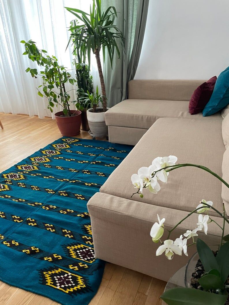 Romanian handwoven carpet with blue ground and yellow details