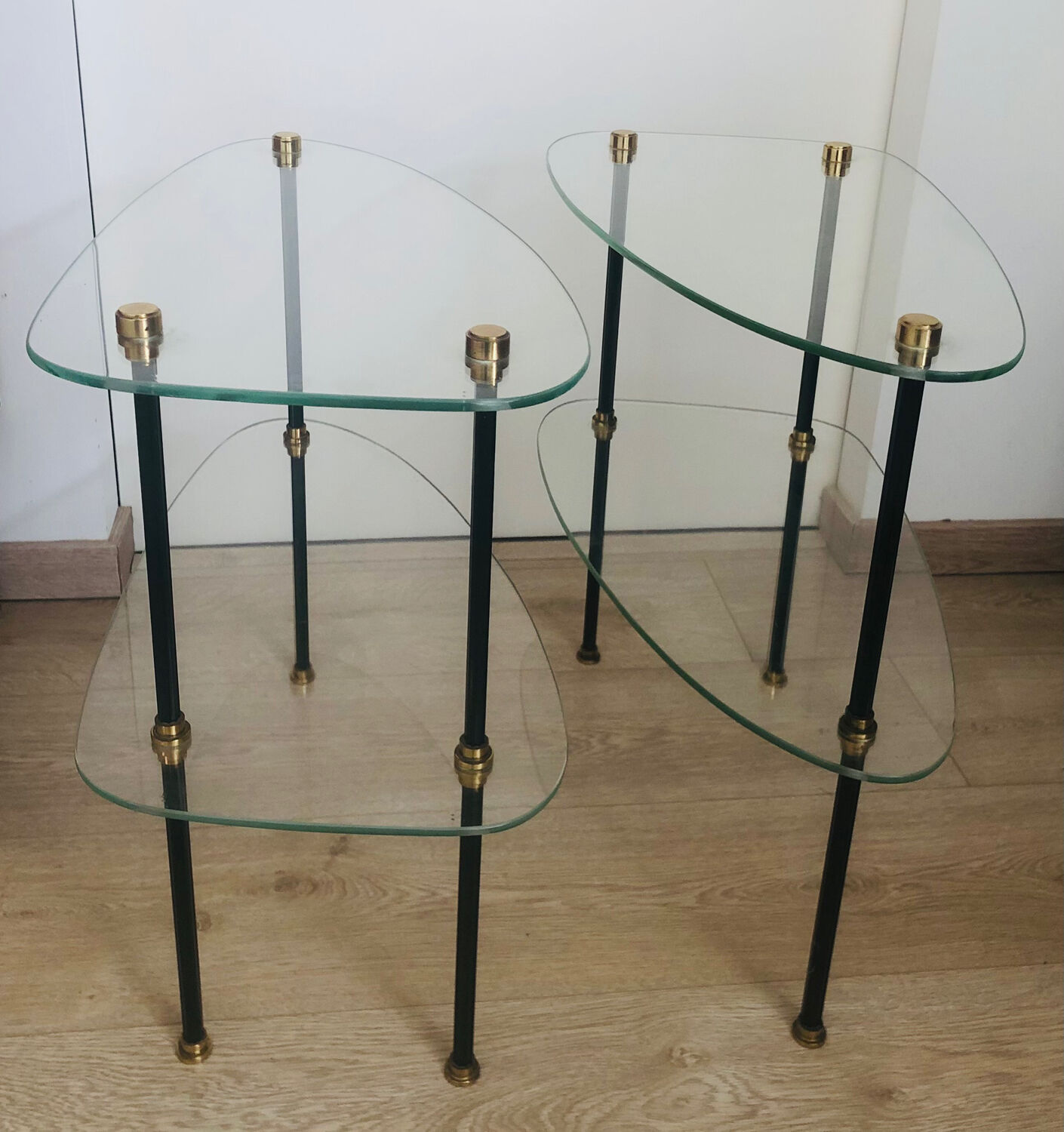 2 small side tables in glass and Bakelite with gold nuts from the 1960s.