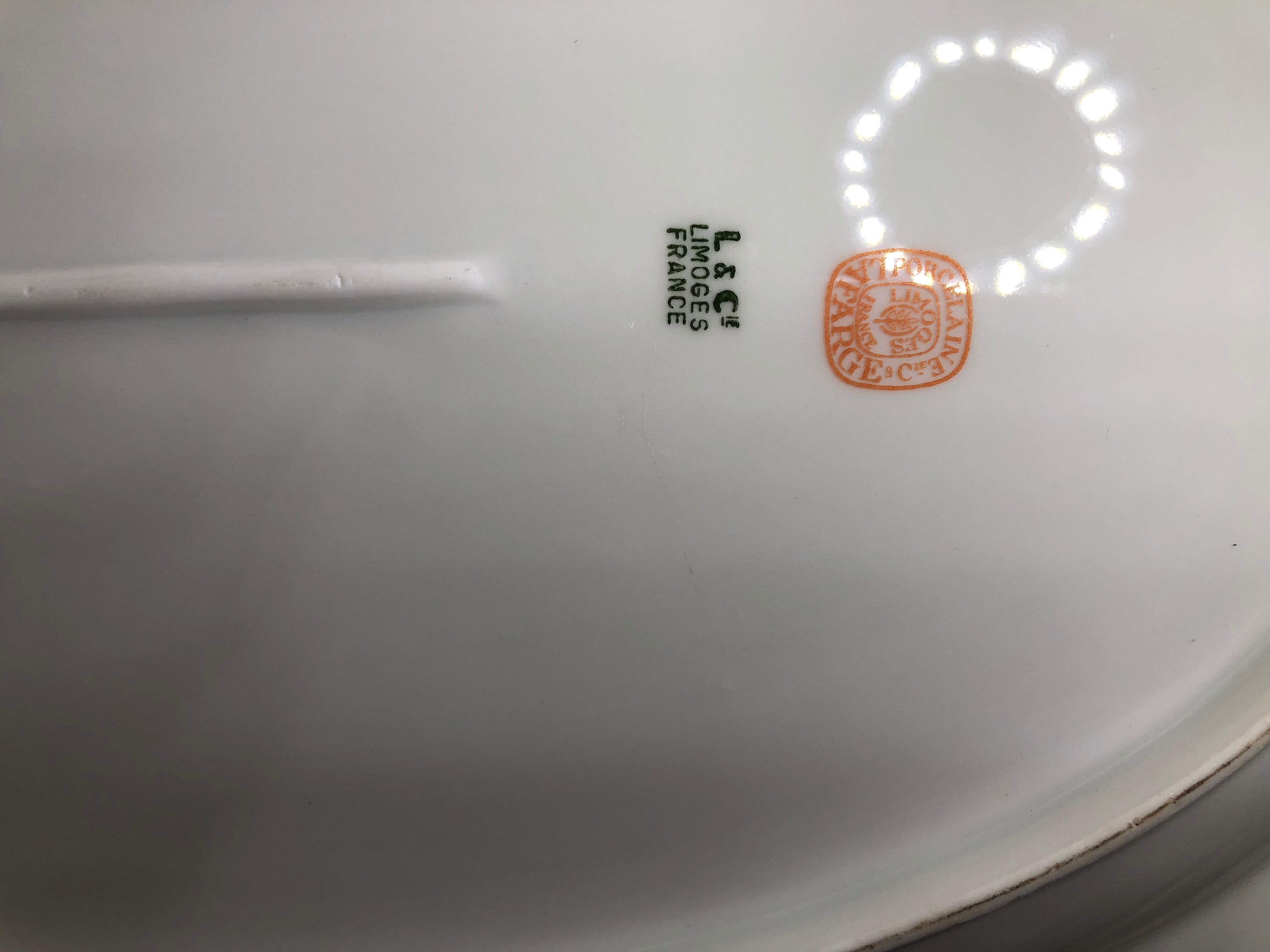 Very large oval Christmas dish in Limoges porcelain white and gold 43cm