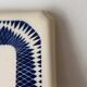 Vintage old trivet Badonviller blue graphic pattern