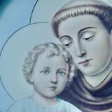 Old religious light frame in gilded stucco and curved glass