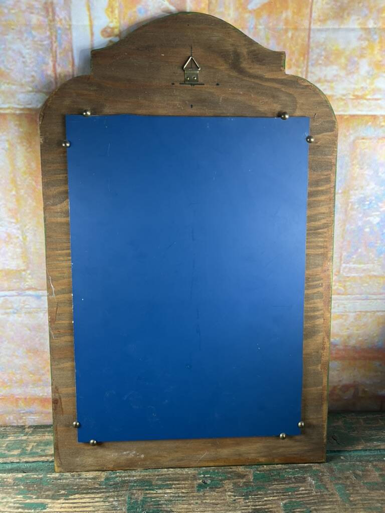 Shabby green mirror with flowers