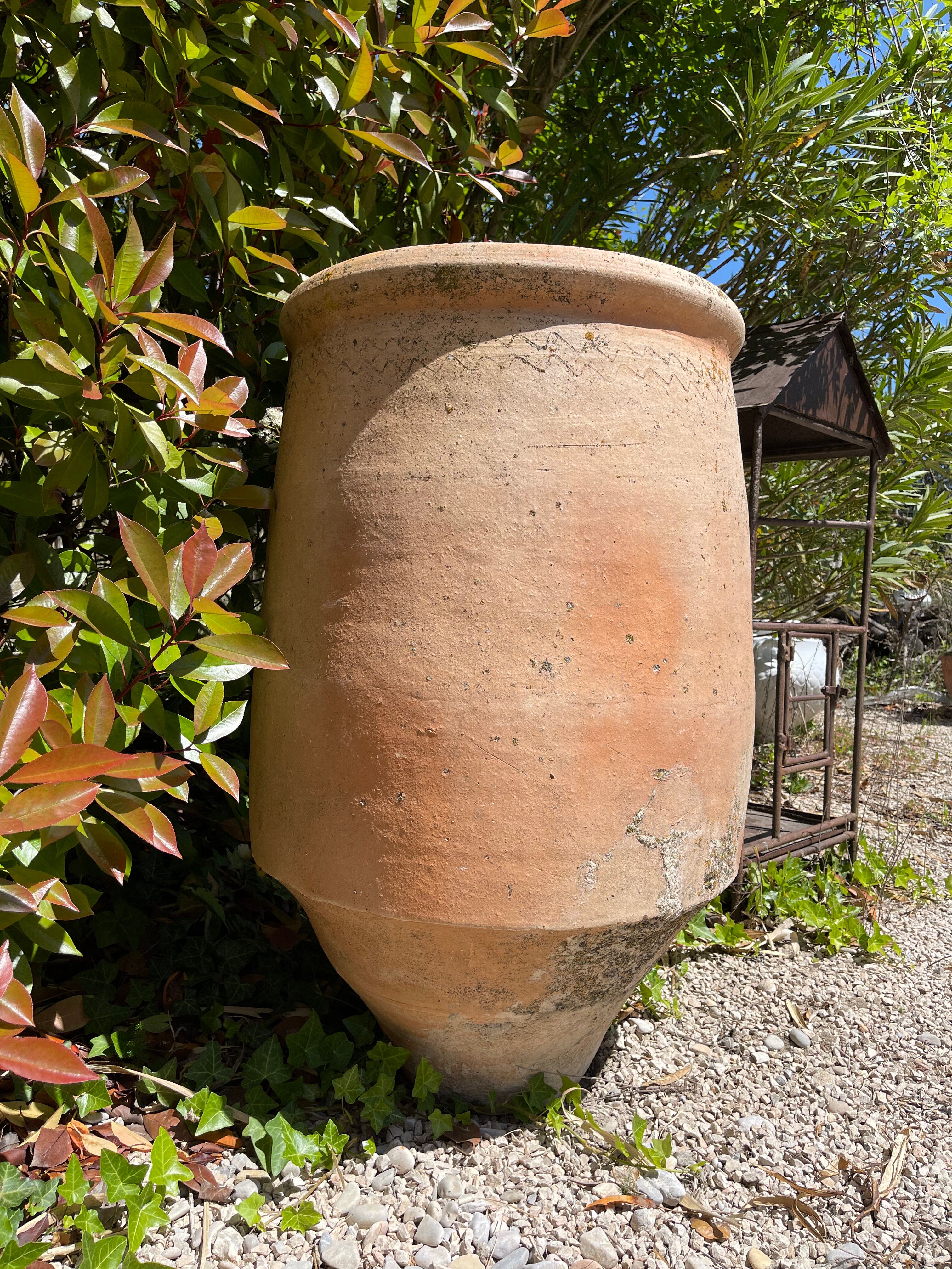Ancient terracotta pottery jar