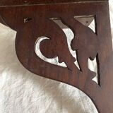 small old openwork wooden wall shelf