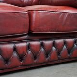 Beautiful red cowhide sleekly designed Chesterfield 2-seater sofa