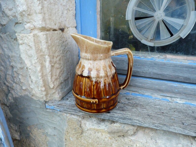 Former wine pitcher in glazed earth style bistrot auberge