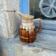 Former wine pitcher in glazed earth style bistrot auberge