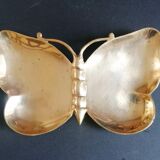 Empty brass butterfly pocket