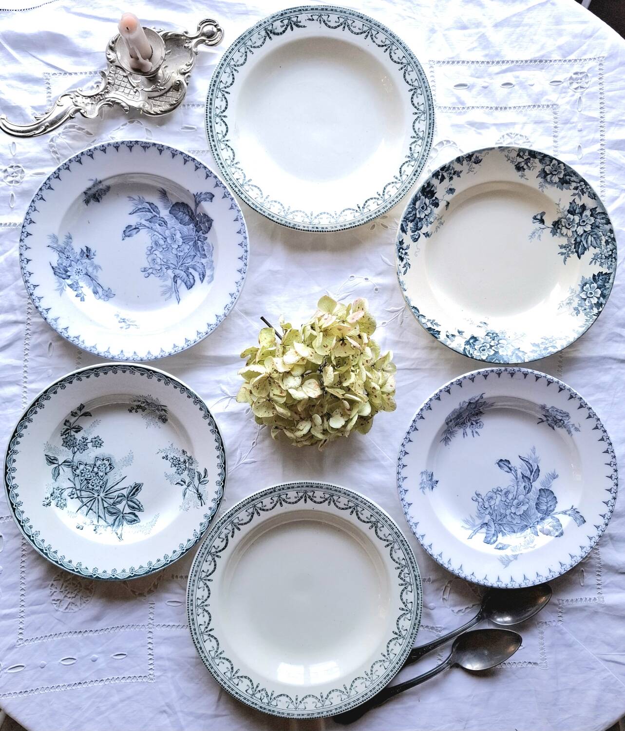 Antique mismatched earthenware soup plates with a tureen