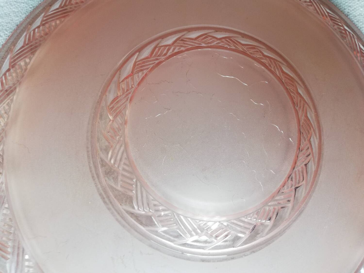 Antique ceiling light in frosted and engraved pink glass.