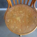 Old swivel office armchair in curved wood