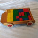 Wooden pull cart with its shapes to build