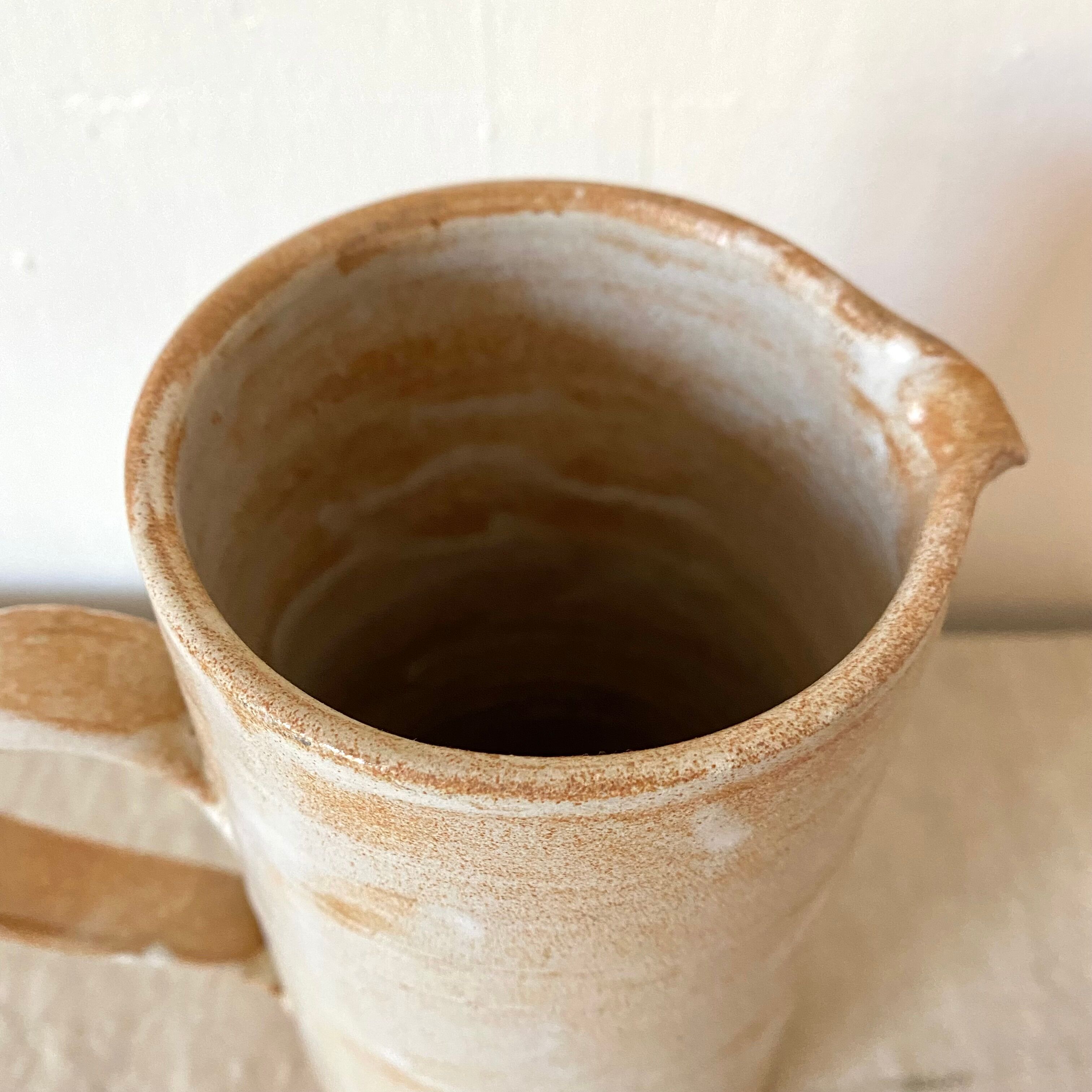 Stoneware pitcher with floral decoration