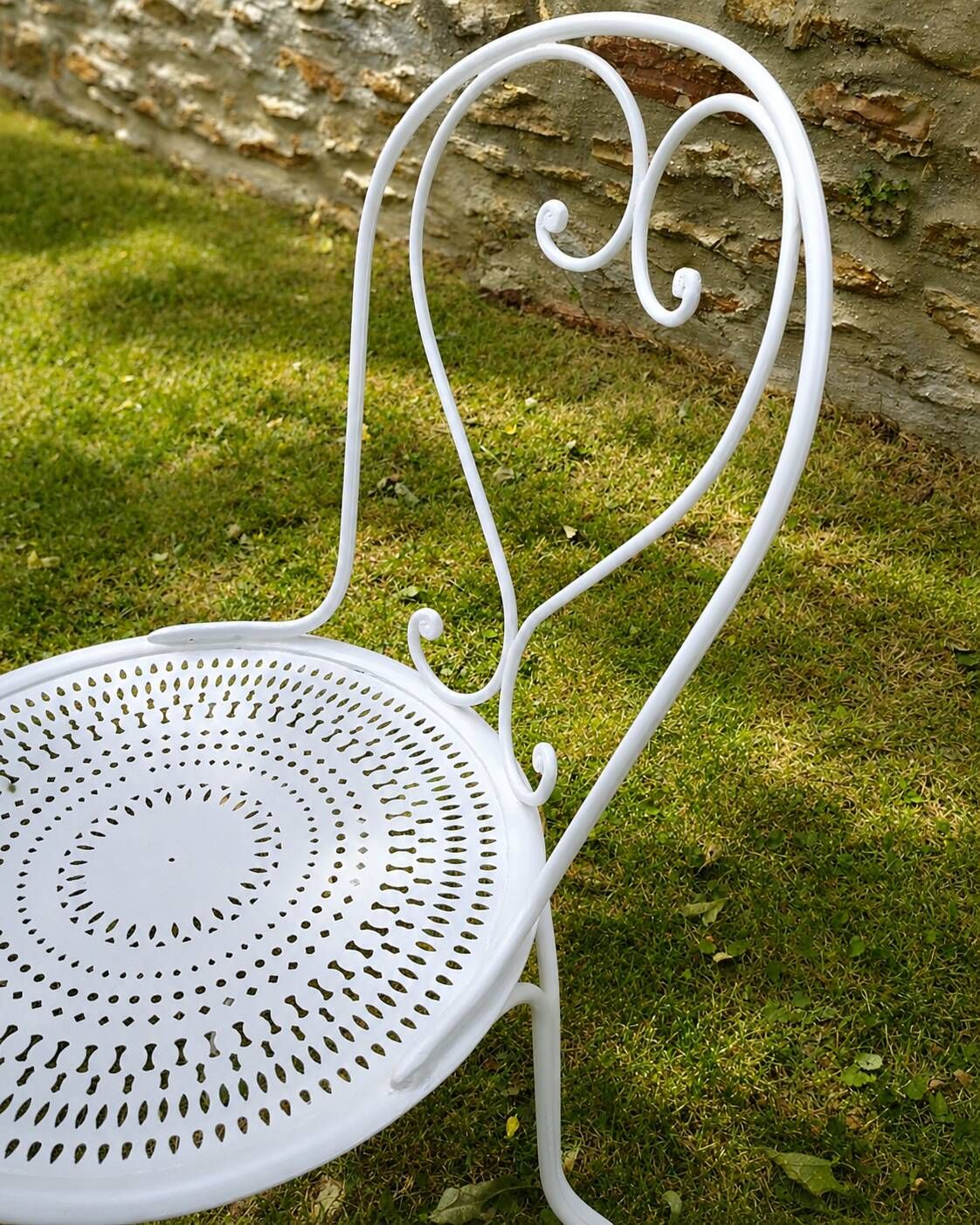 Renovated antique garden furniture in wrought iron, early 20th century.