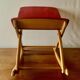 Vintage rocking footstool in red Skai and wood