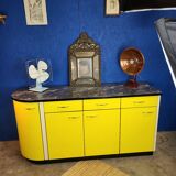 Vintage yellow sideboard, and black marble top.