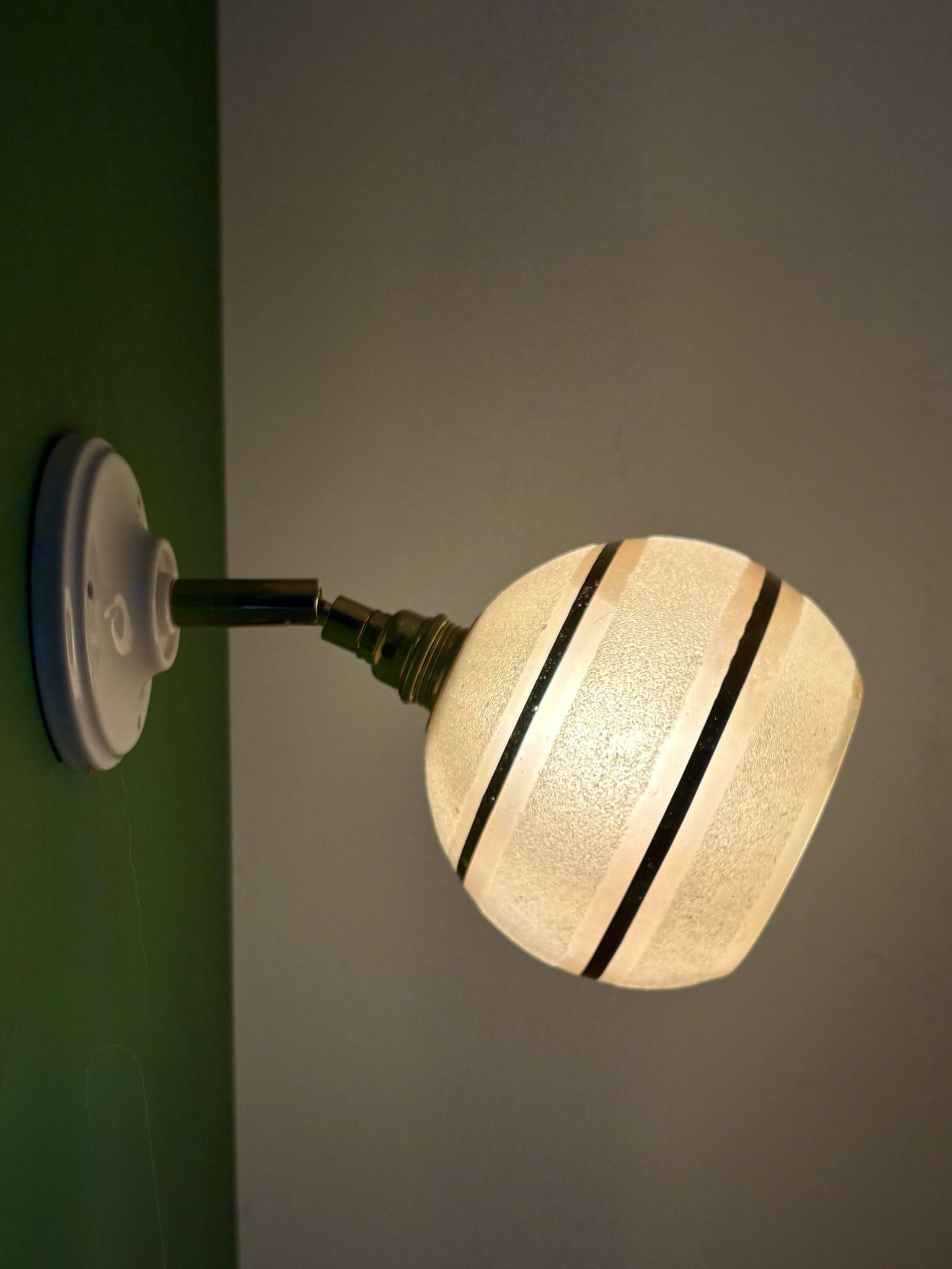 Vintage globe wall light in frosted yellow and gold glass.