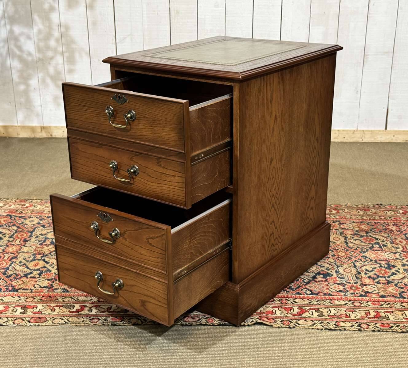 Office cabinet in oak with English leather top from the 1990s.