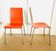 2 bicoloured wood and steel chairs in orange and red from Habitat, around 1990.