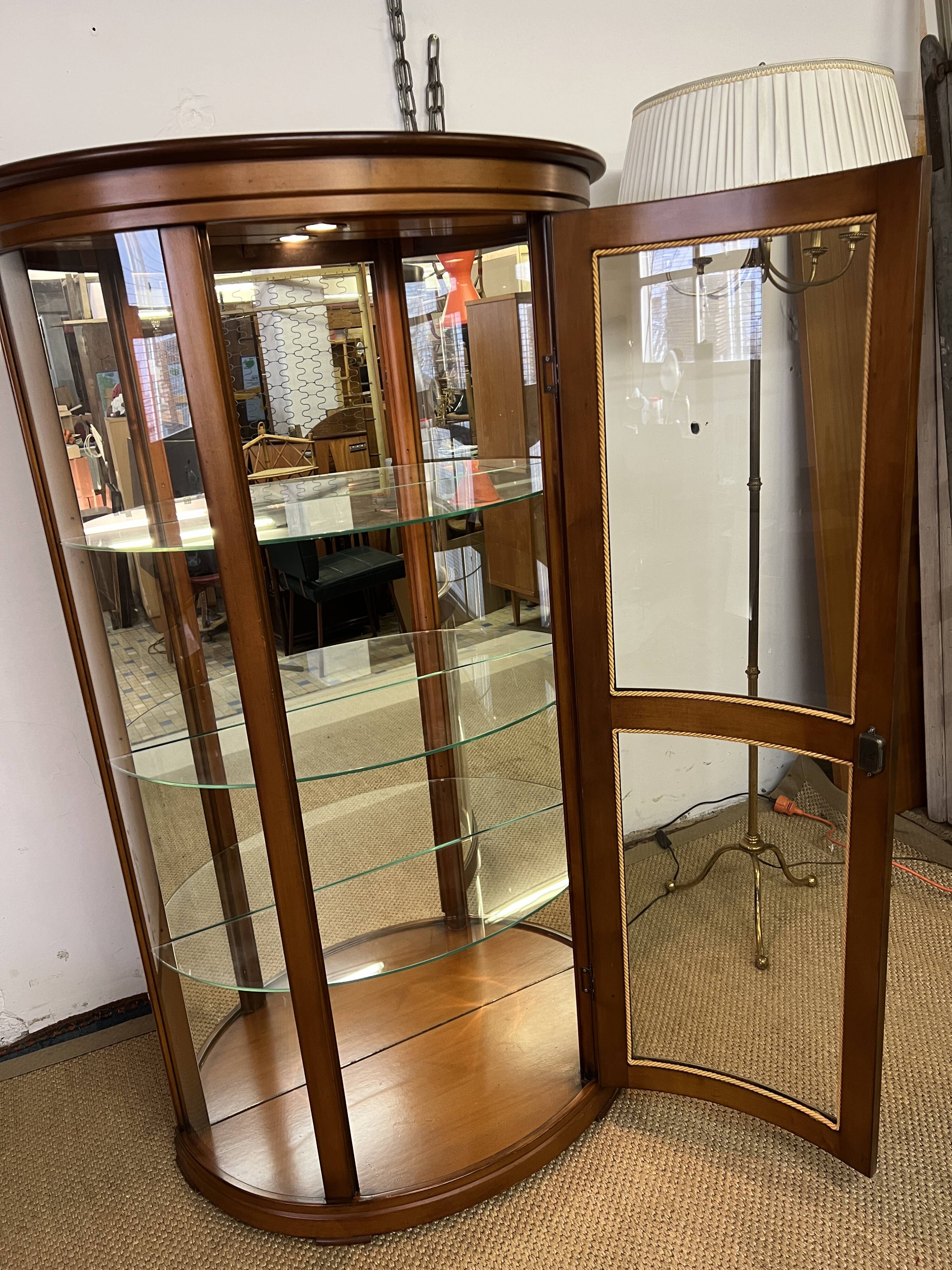 Wooden display case and half-moon mirror