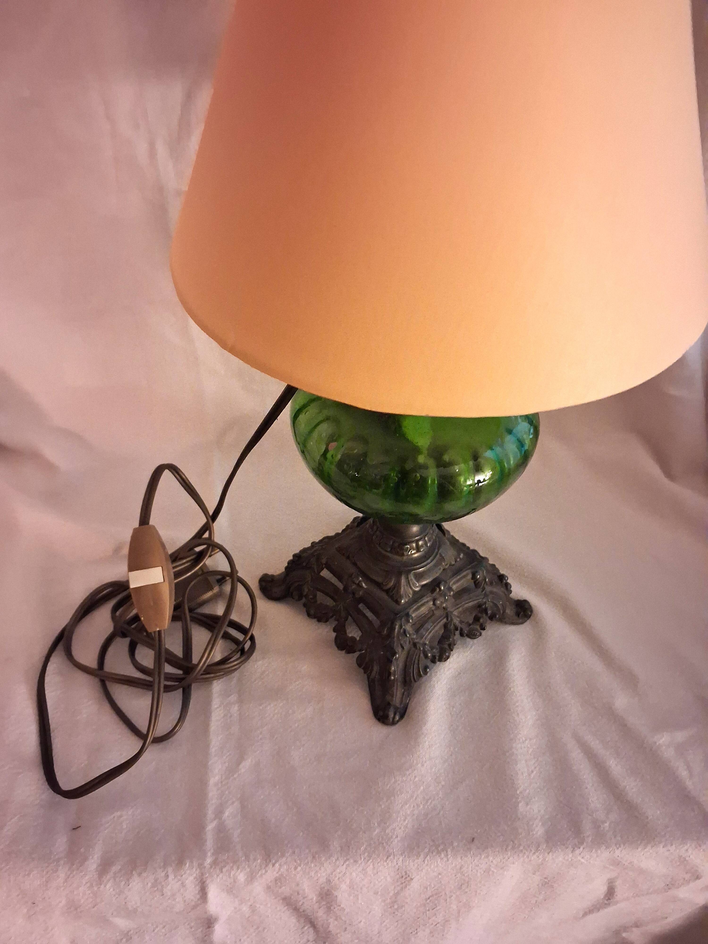 Antique oil lamp with lampshade, for table use.