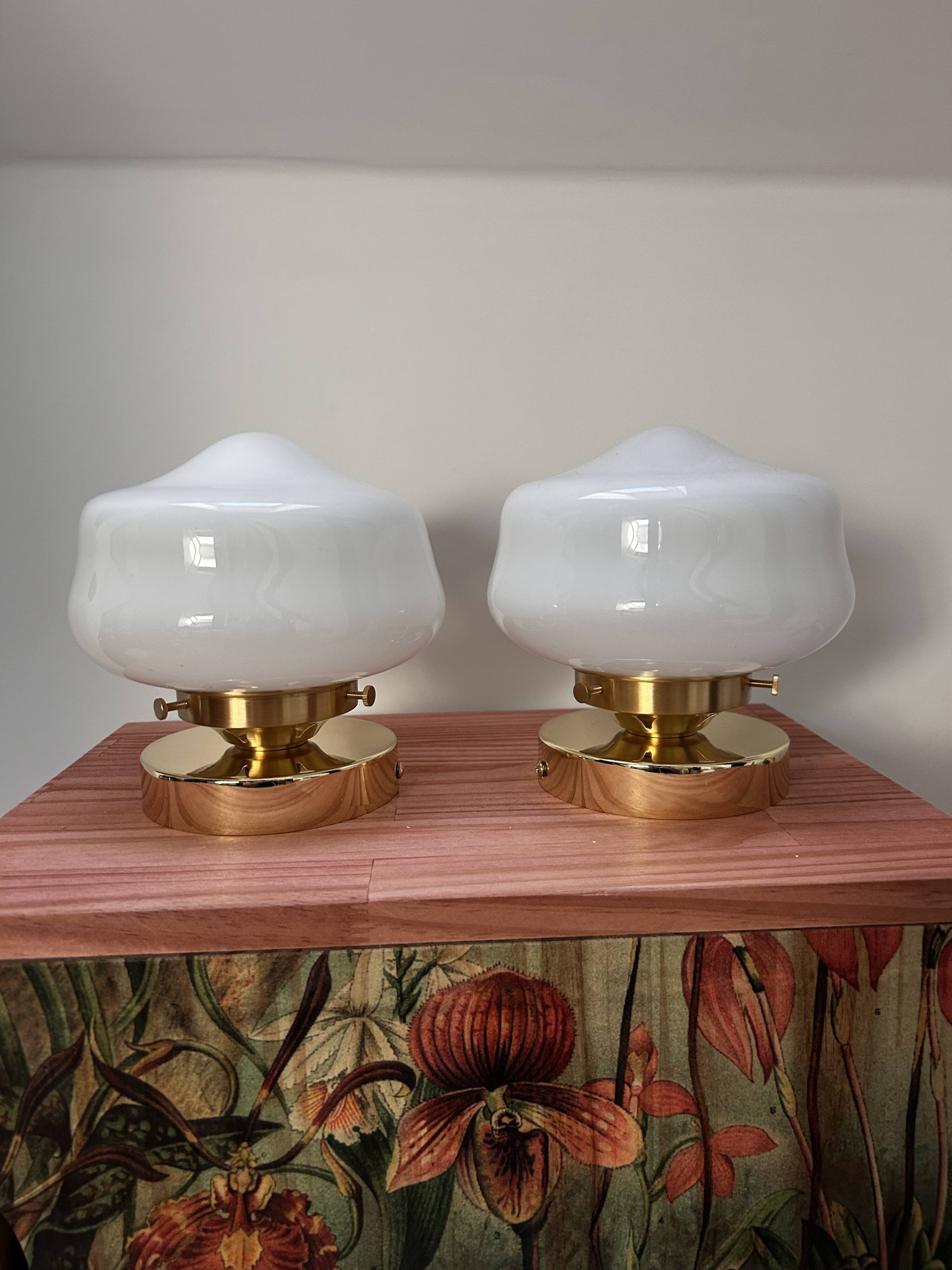 Pair of white opaline globe wall lights