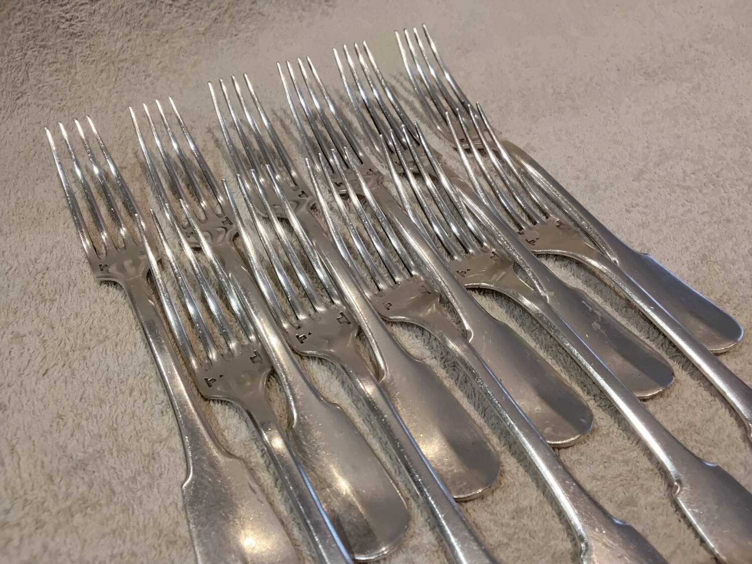 11 silver-plated table forks by Christofle Cluny with stripes