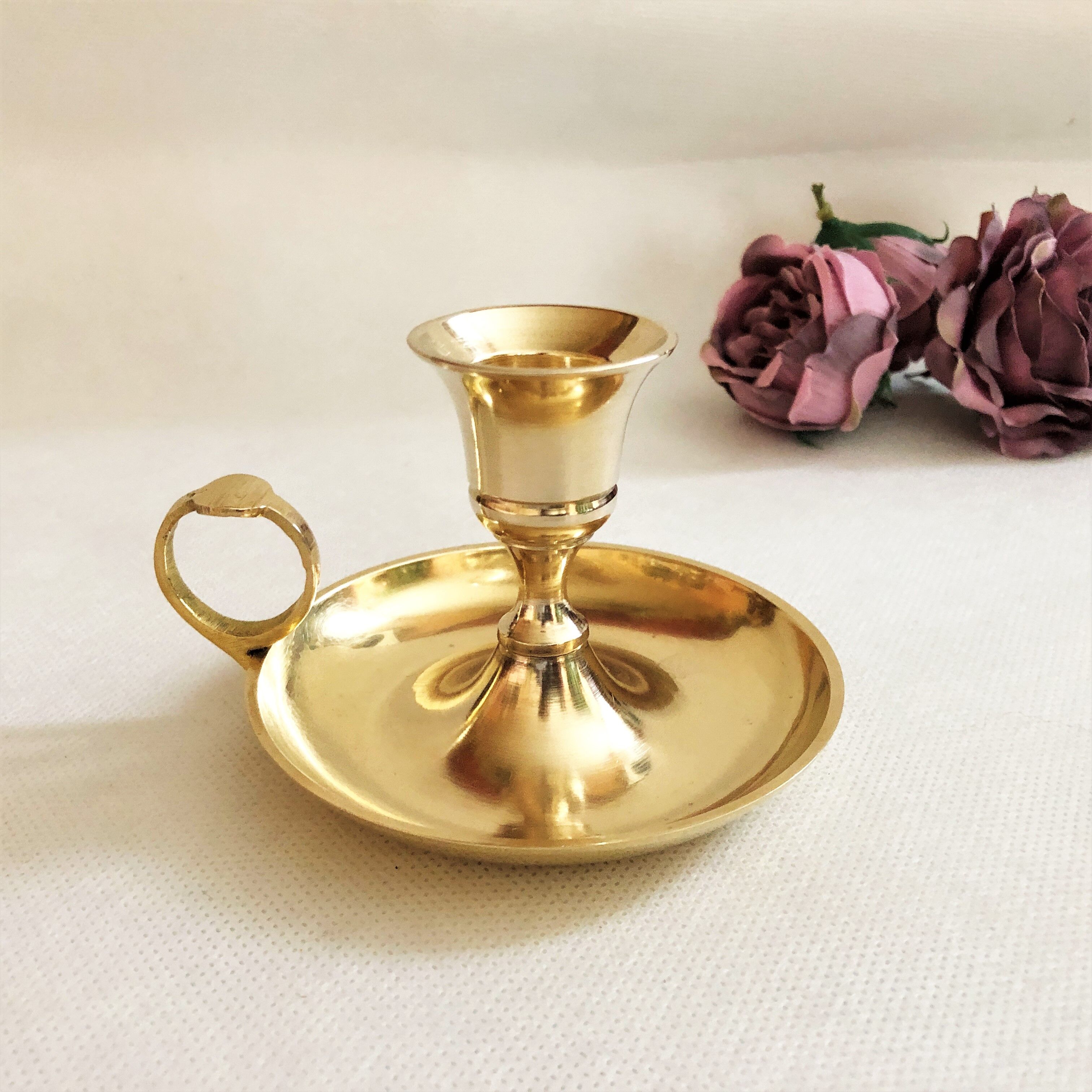 Gilded brass hand candle holder