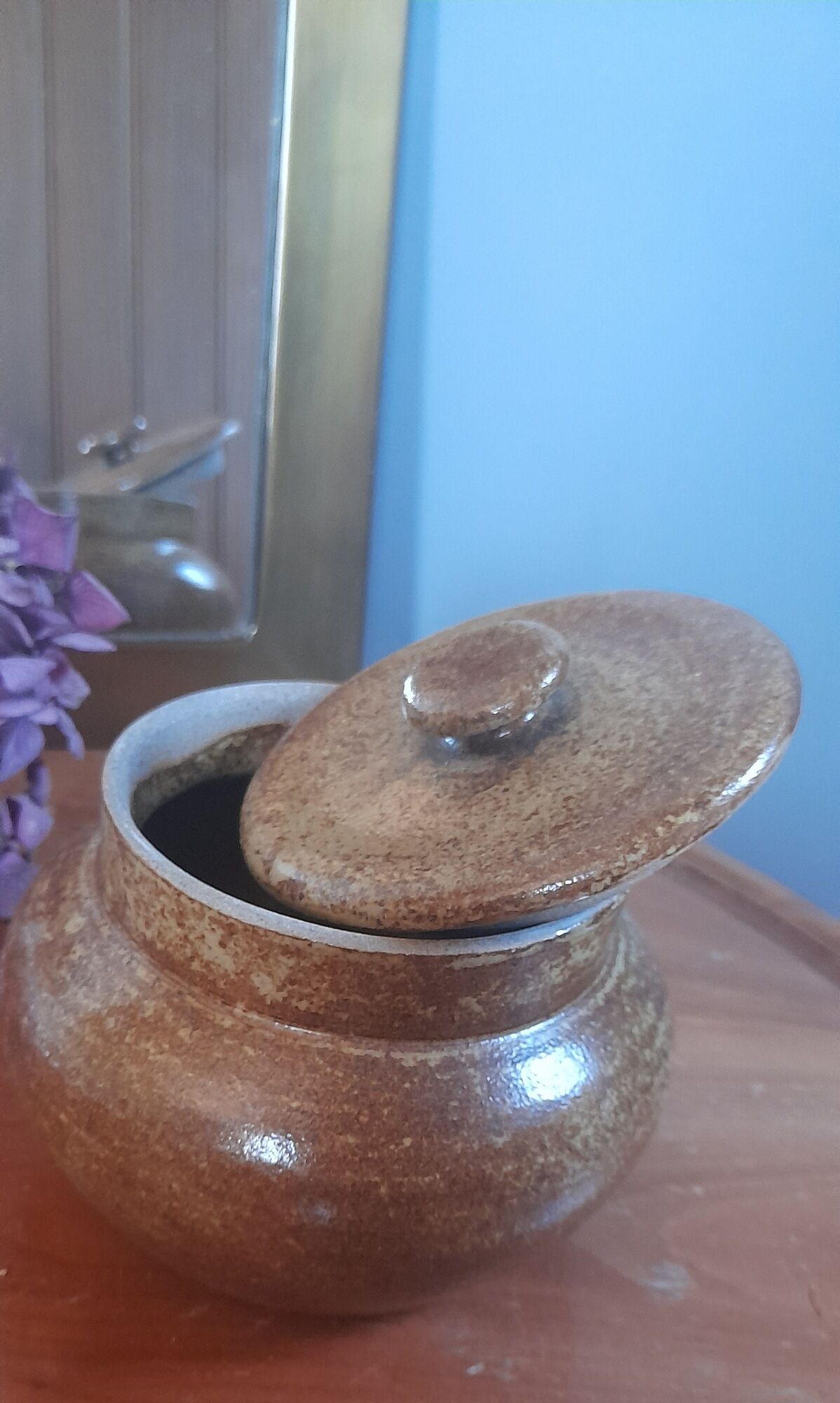 Old salt pot in sandstone, with lid