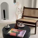 Reclined armchair in canned teak in natural wood