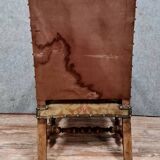 Renaissance armchair in carved walnut with lion head decoration