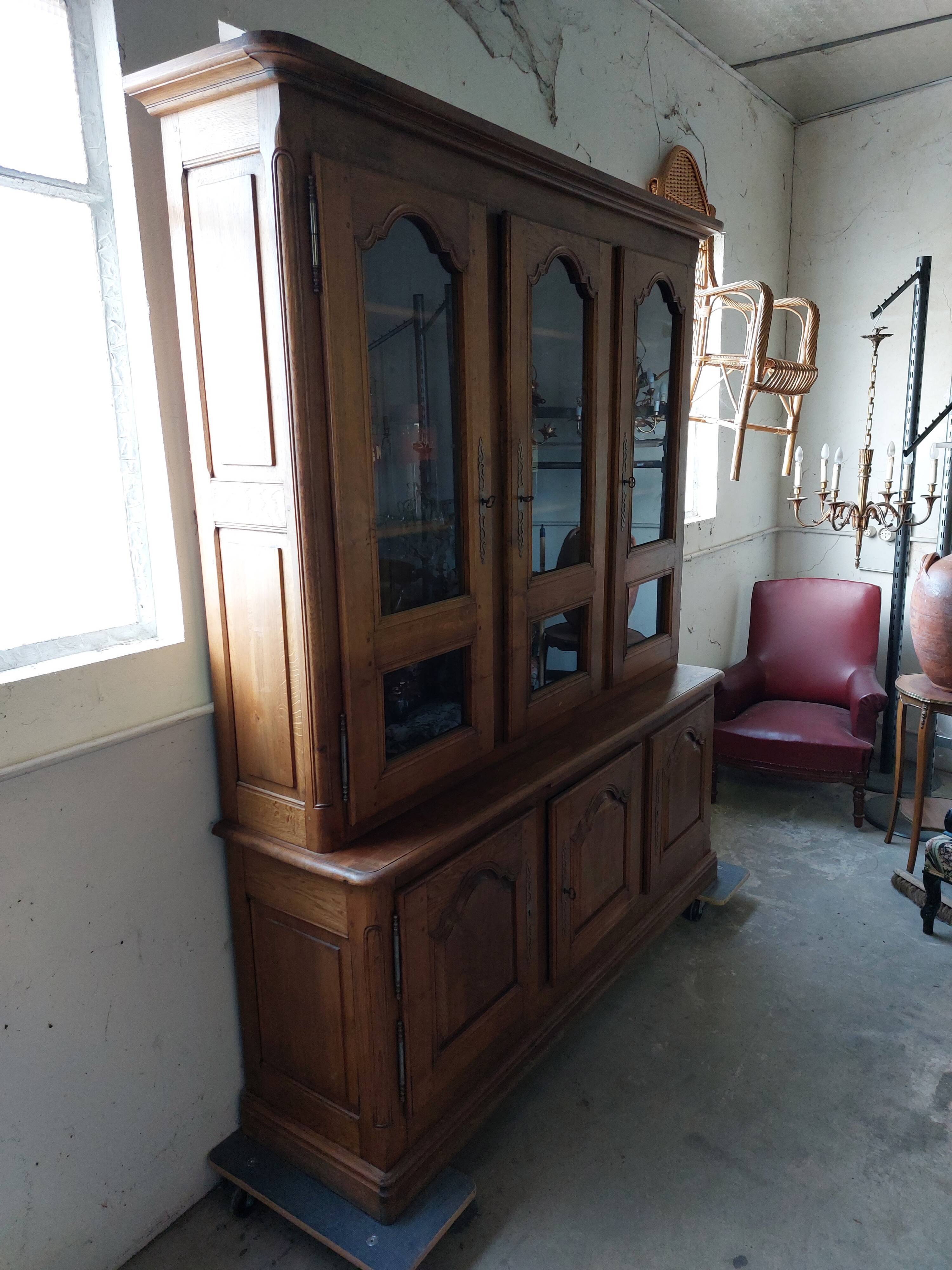Showcase library with two sections in solid oak.