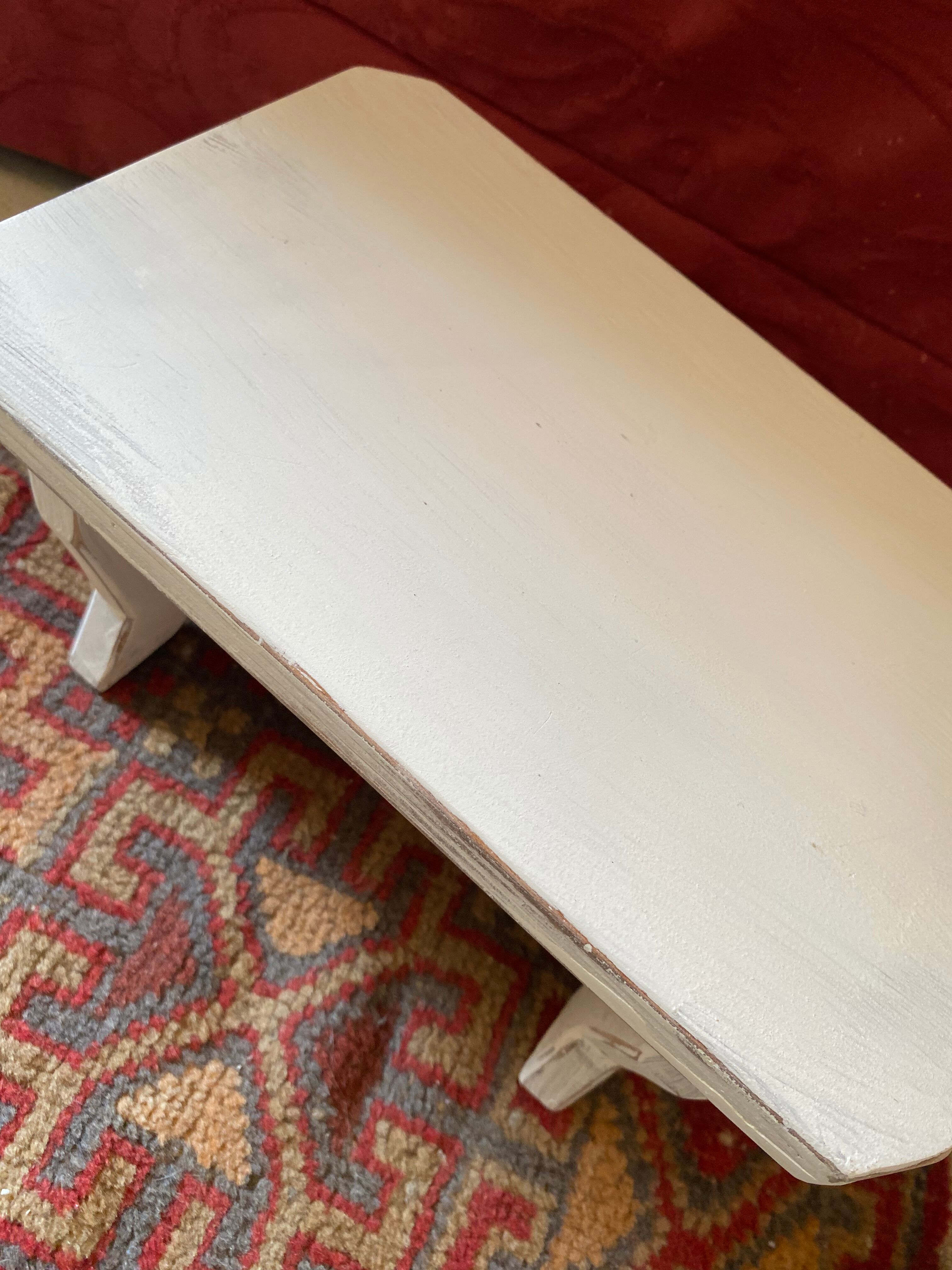 Patinated wooden footrest.