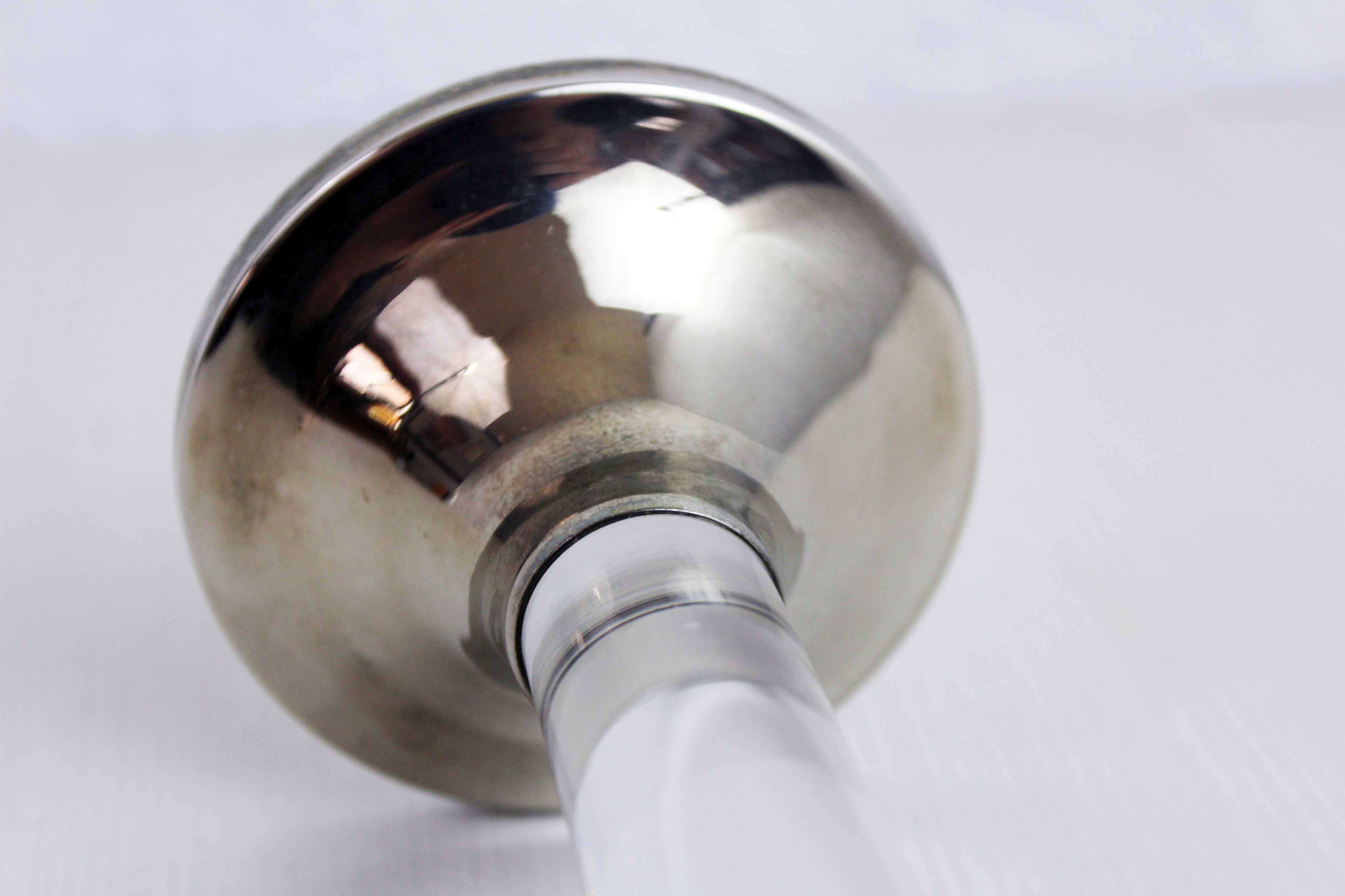 Candle holder in silver metal and lucite