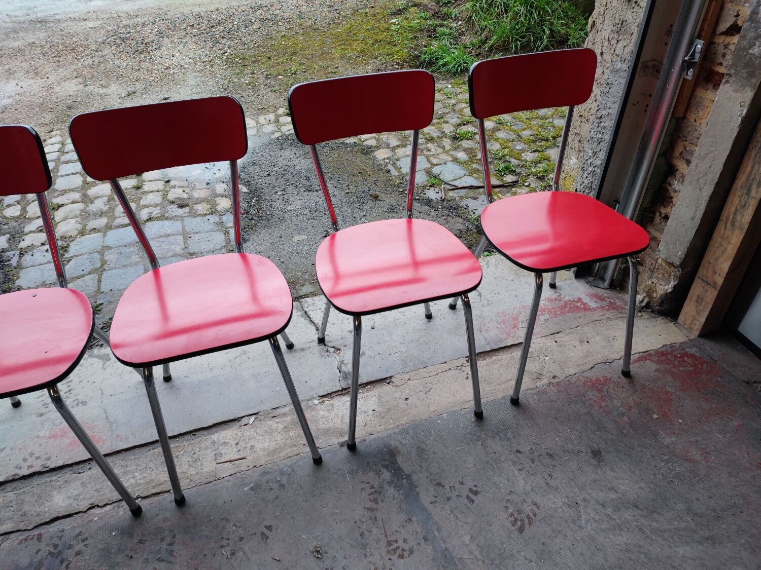 6 red and chrome Formica chairs