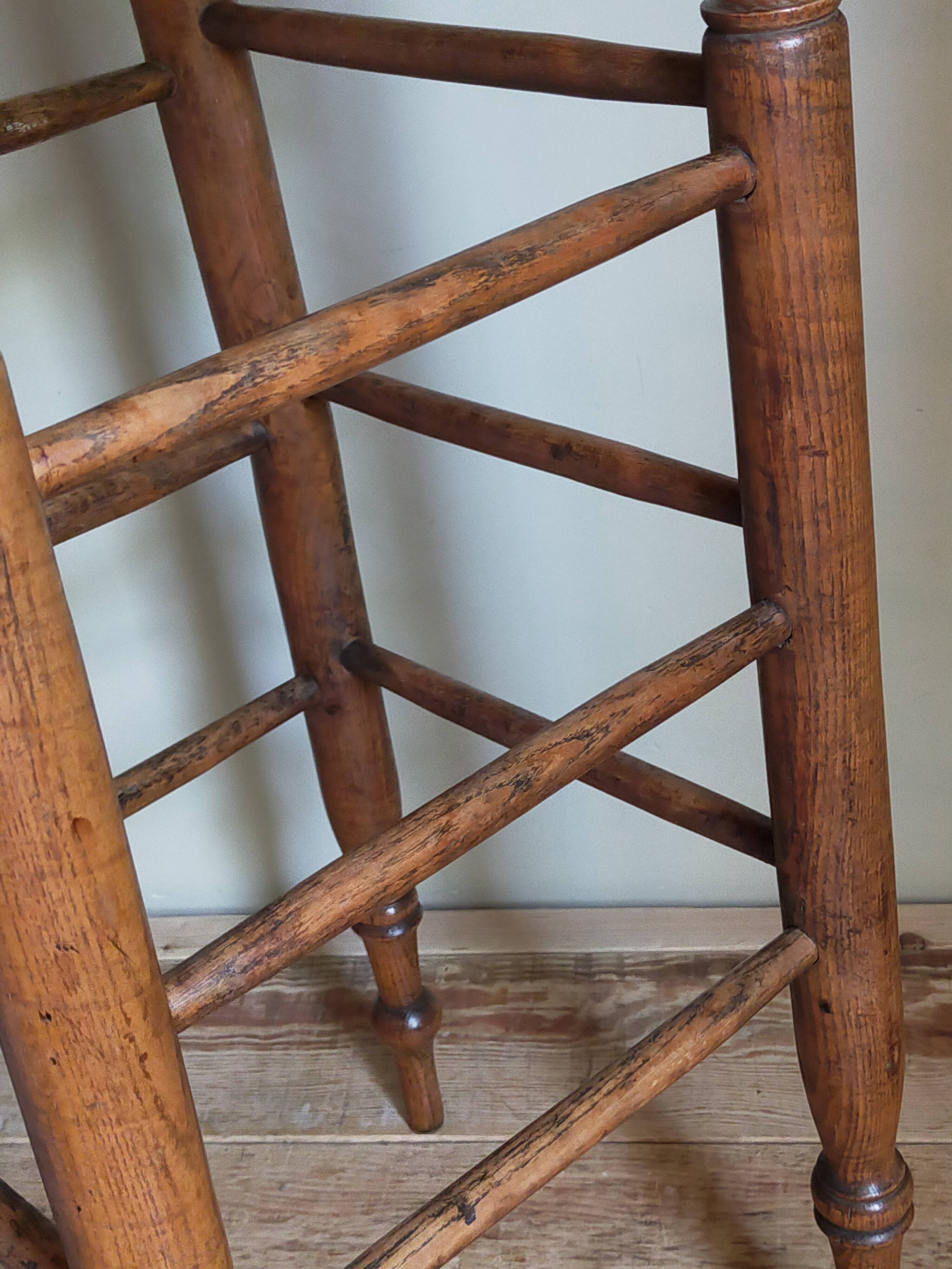 Antique stool with cane and turned wood