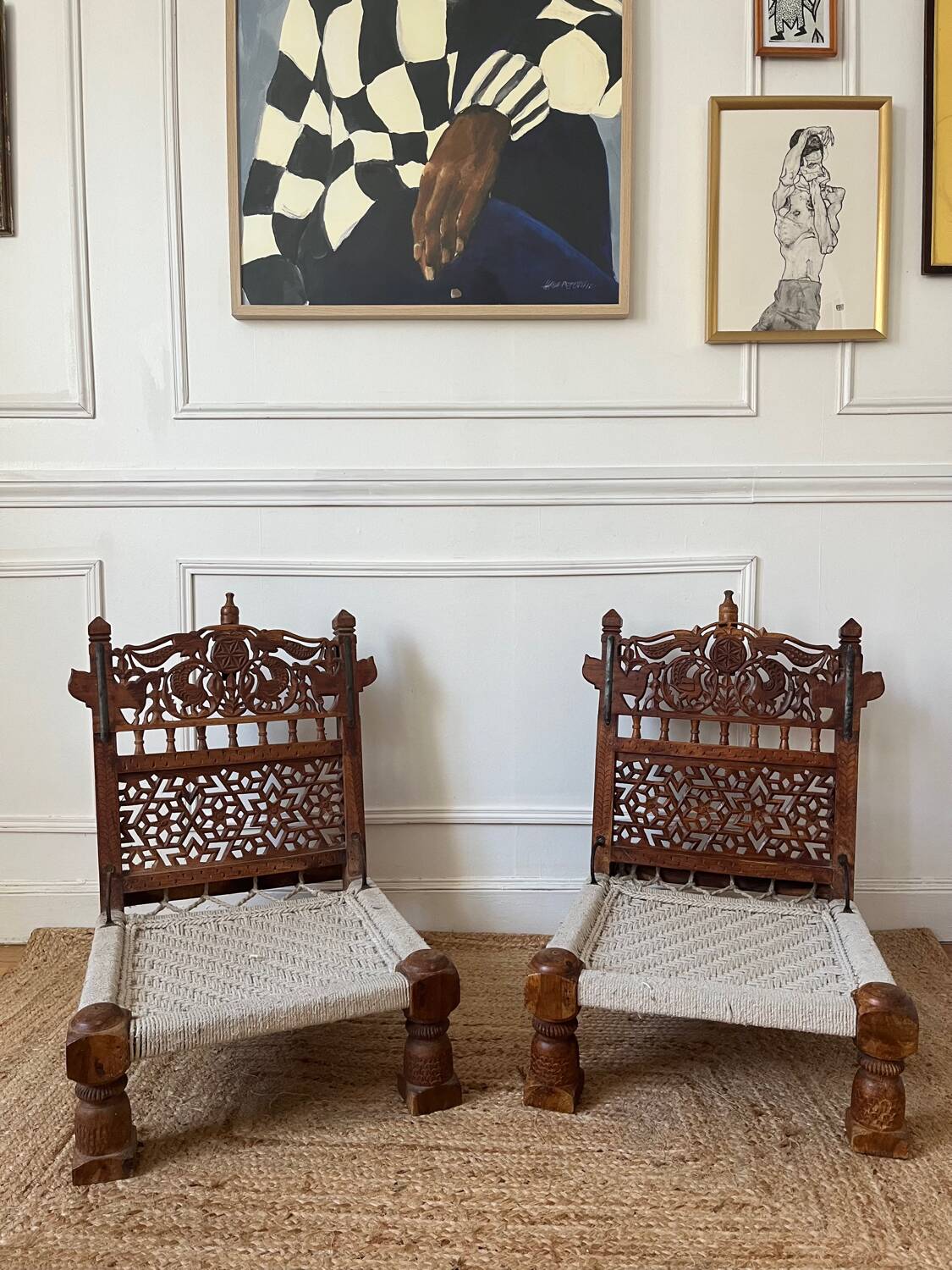 Pair of traditional Indian chairs made of carved wood and rope