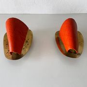 Pair of orange plexiglass and curved brass wall lights, 1950s, Germany