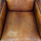 Set of 2 stylish yet comfortable armchairs made of sheepskin leather with a sleek design