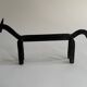 Pair of animal-shaped wrought iron and hammered fire dogs in primitive brutalist style.