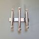 Tubular wall light in chromed metal