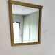Miroir en bois doré, de forme organique avec une glace biseauté