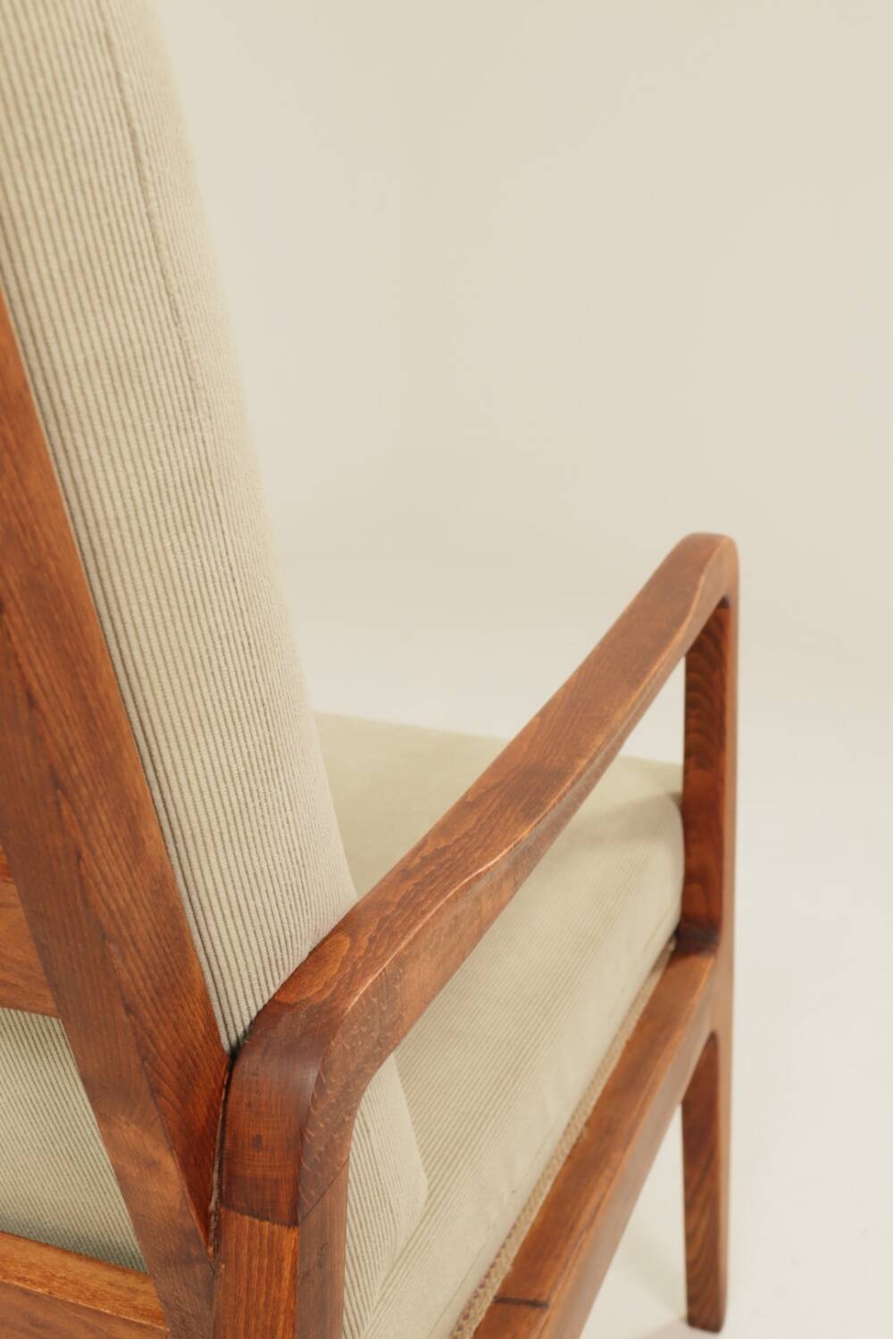 Vintage armchair in olive corduroy with a wooden frame.