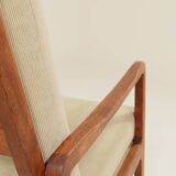 Vintage armchair in olive corduroy with a wooden frame.