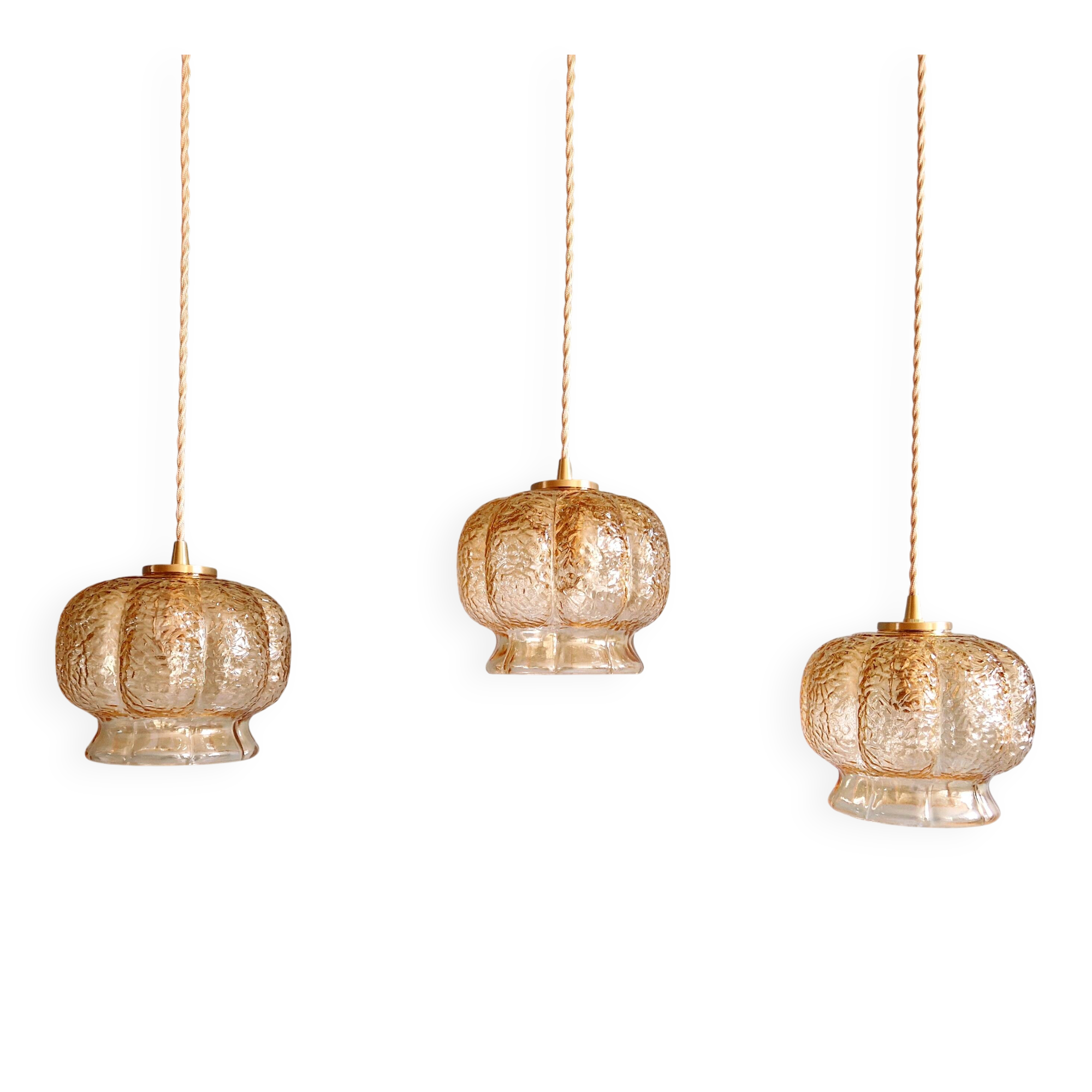 Vintage trio of amber glass pendants, 1960s-70s.