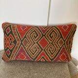 Red and gold ethnic pattern cushion